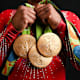 Biles shows off her gold medals from Rio 2016.